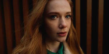 young woman looking afraid of dark psychology tricks being used on her