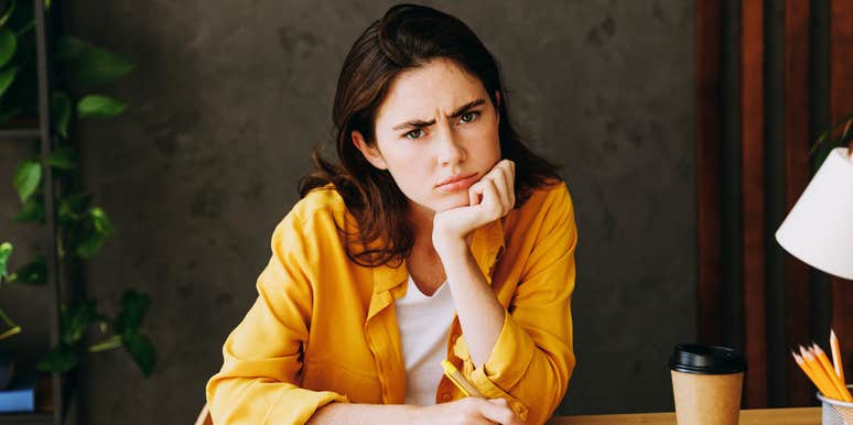 job candidate sitting across from an interviewer with a tense awkward pause, capturing the moment a salary question abruptly ends a conversation