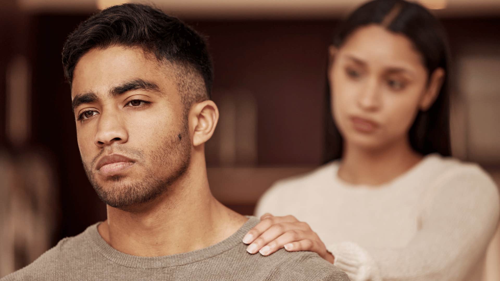 man playing mind games ignoring woman
