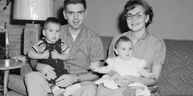 frugal young family from the 1960s sitting at home