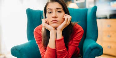 If These Everyday Situations Stress You Out, You're Probably Smarter Than Most People highly intelligent woman sitting in armchair looking stressed out