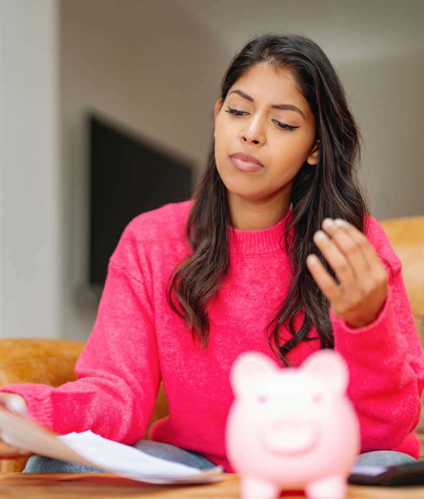 Calm person with piggy bank showing awareness in clear decisions