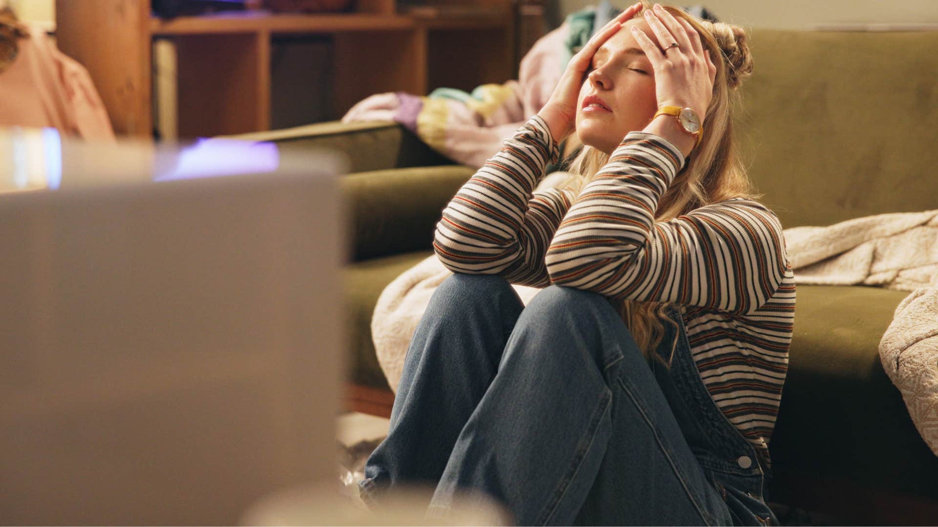 Woman struggling to ask for help at home.