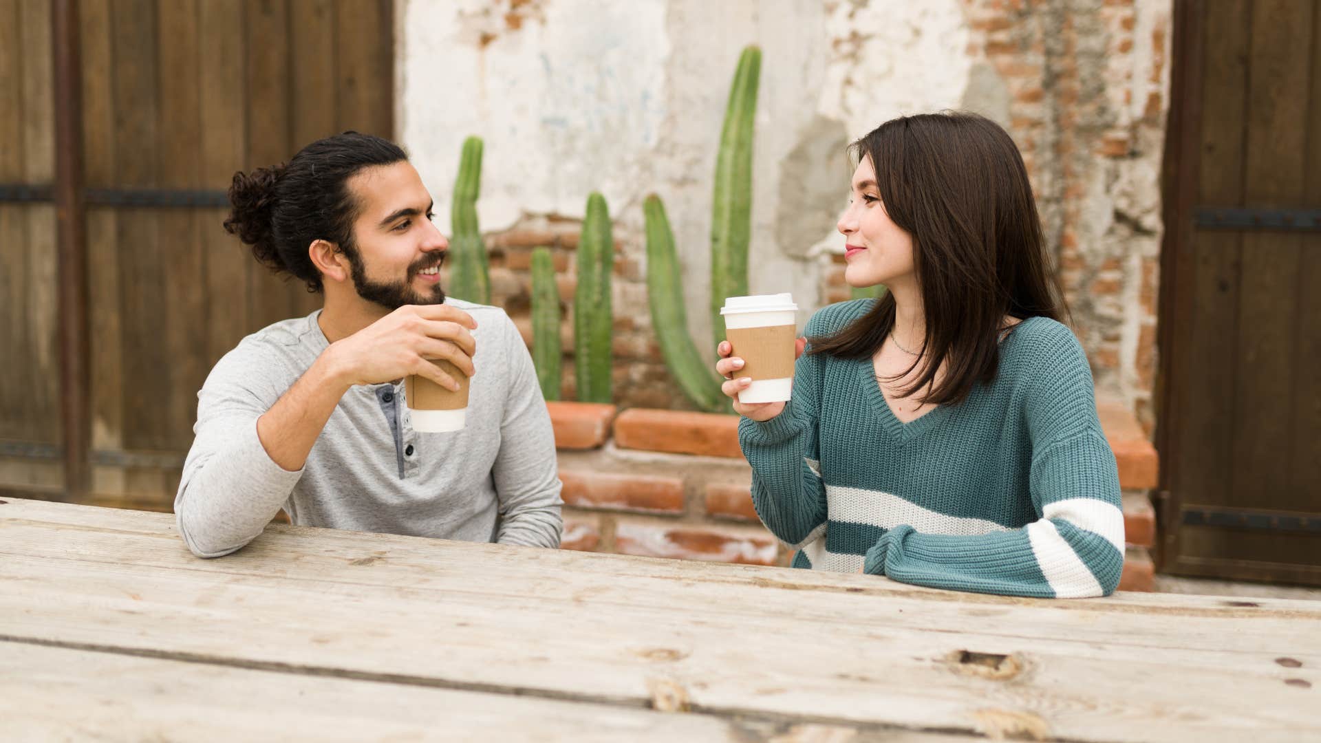 man having an intimate conversation with woman