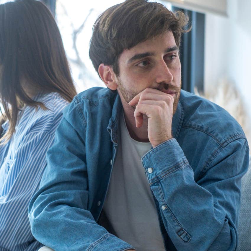 upset man who puts his comfort on a pedestal sitting by his wife