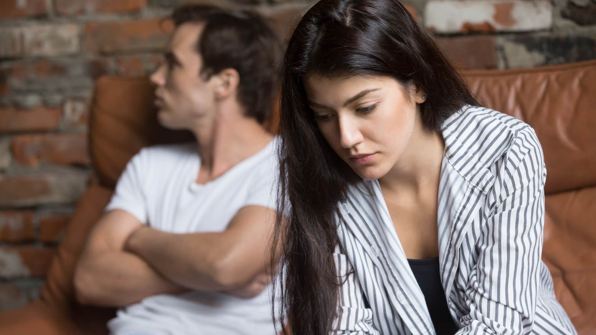 Woman sitting next to her husband who started behaving like a roommate.