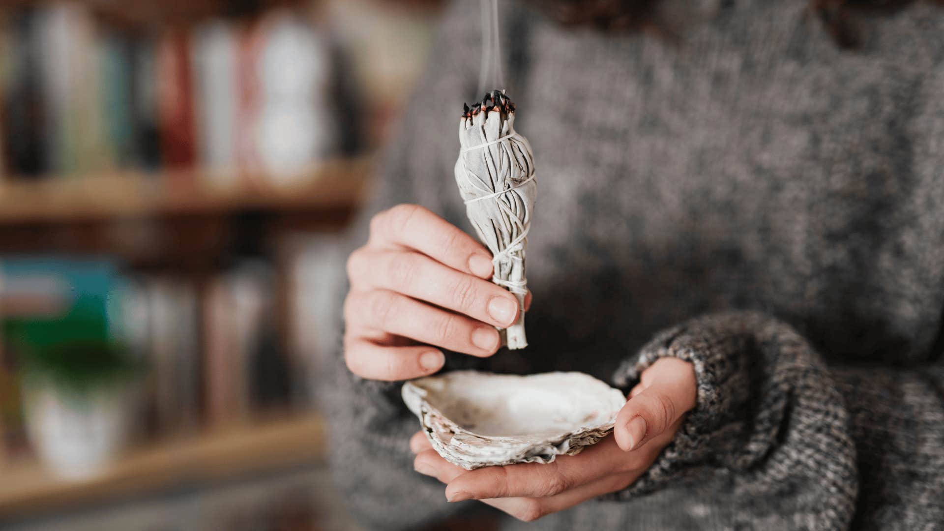 woman smudging around her house