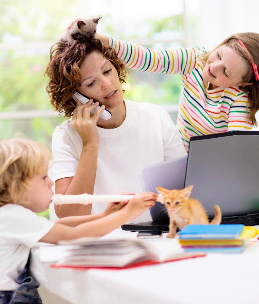 Unrealistic homeschool mom distracted on phone by kids and kitten