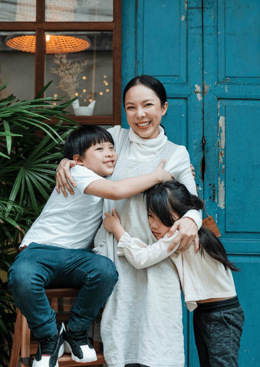 mother hugging her children close