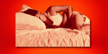 Woman curled in period pain, stage ii endometriosis