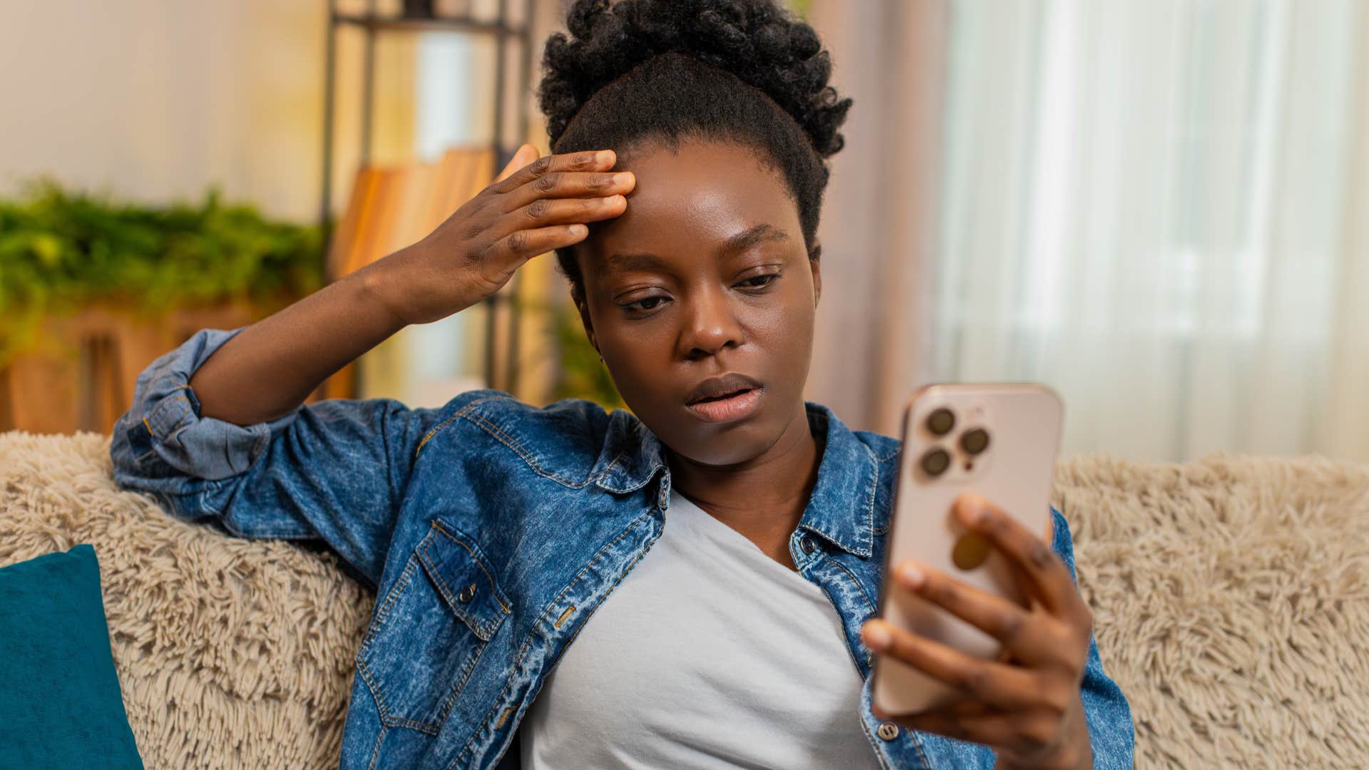 woman looking at phone expecting the worst