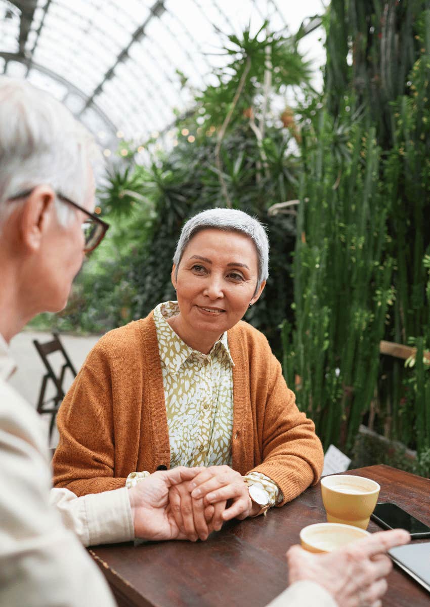 older couple holding hands