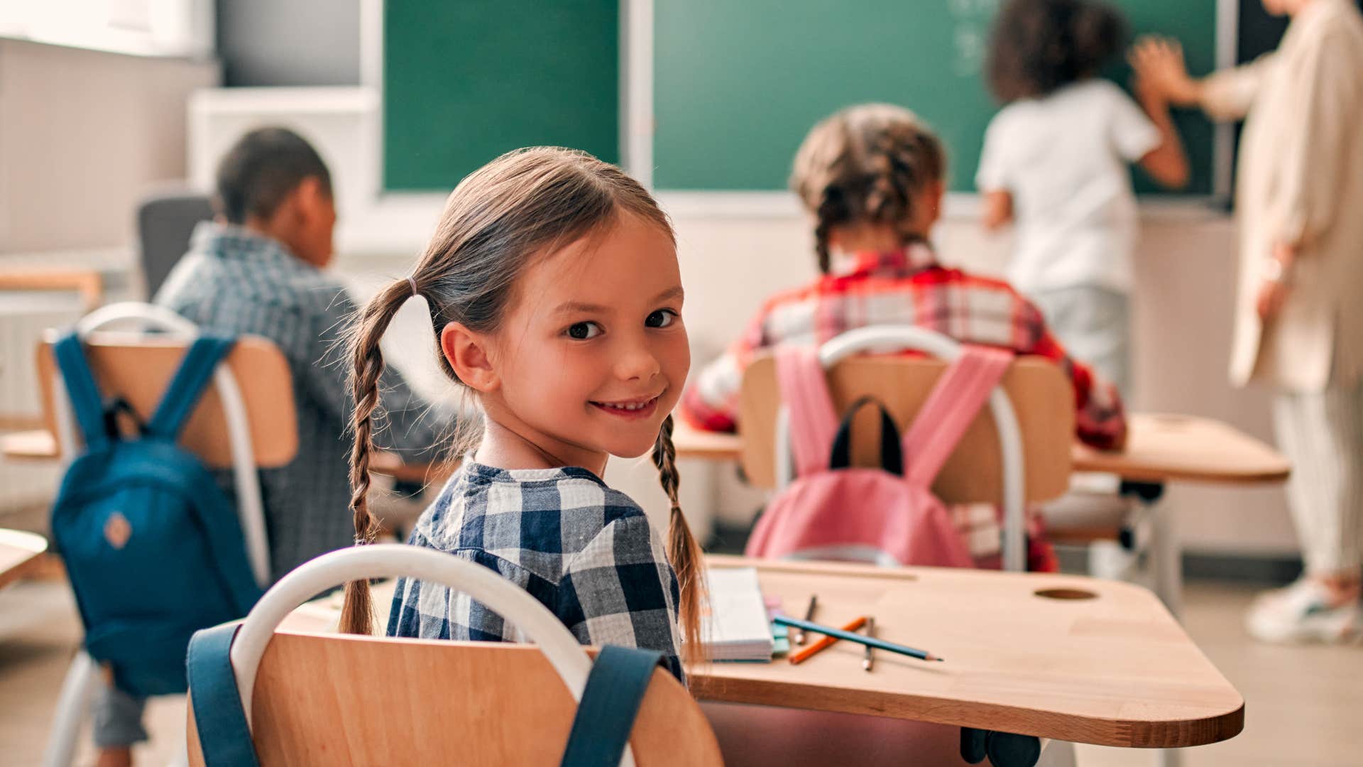 Confident kids in class with teacher