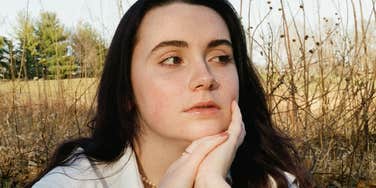 Woman acts together without broadcasting it.