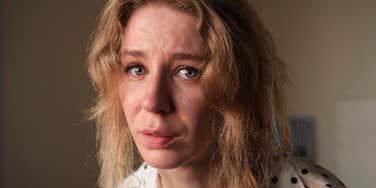 Person in agony from back pain.