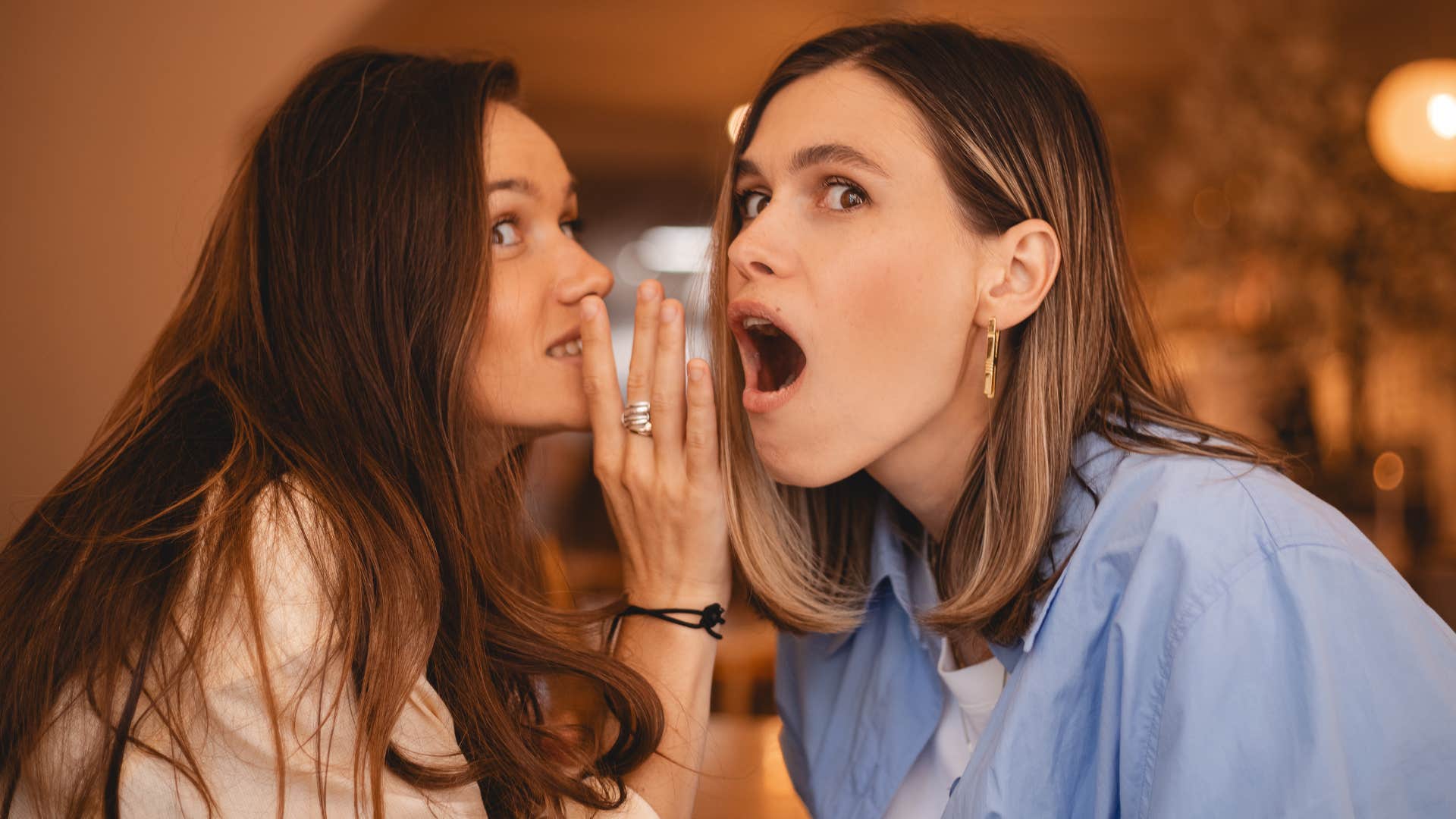 two friends gossiping about people who aren't present