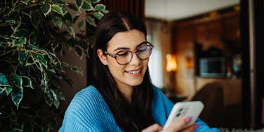 woman looking at pictures posted from 2016