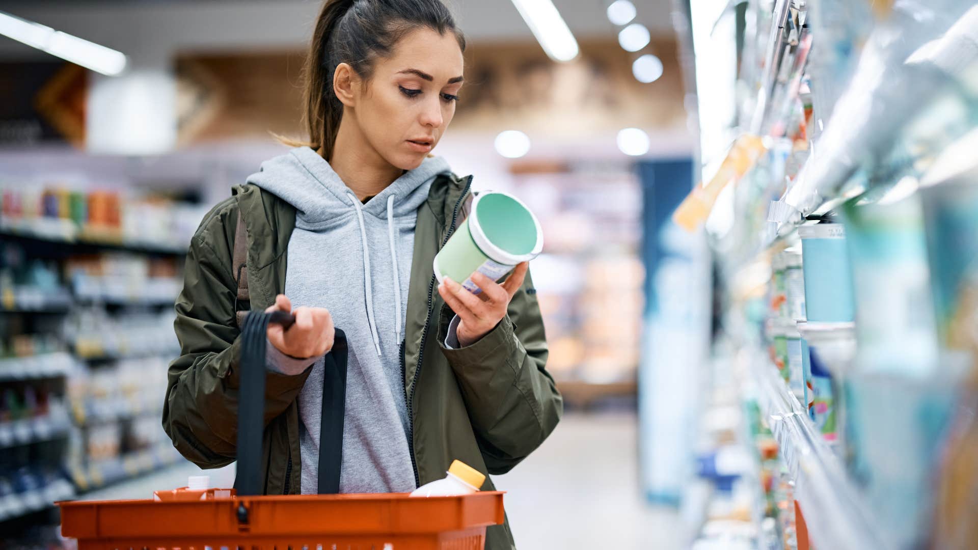 woman deciding if she needs an item while shopping