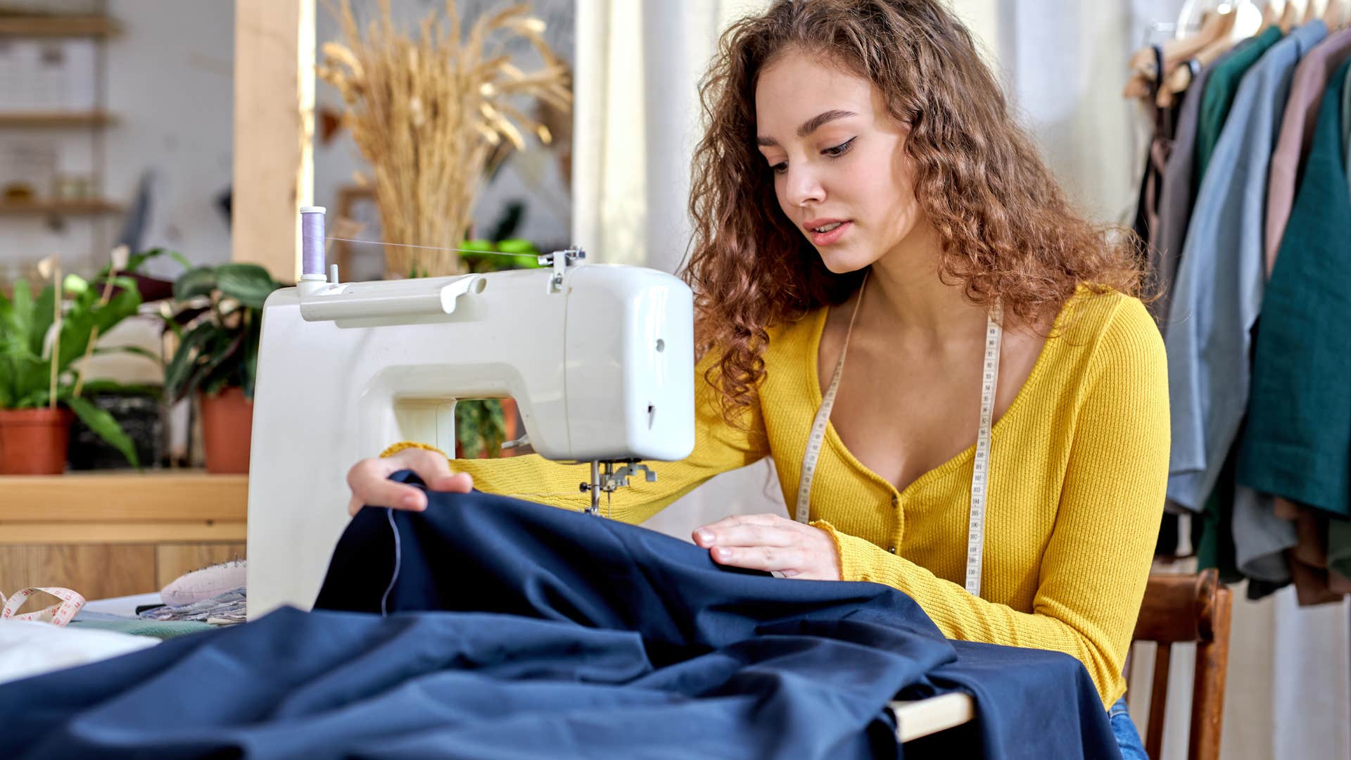 woman making clothes for herself for less