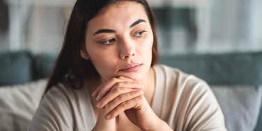 People Who Feel Very Overwhelmed By Life Usually Have These Obvious Behaviors woman feeling overwhelmed by life sitting at home