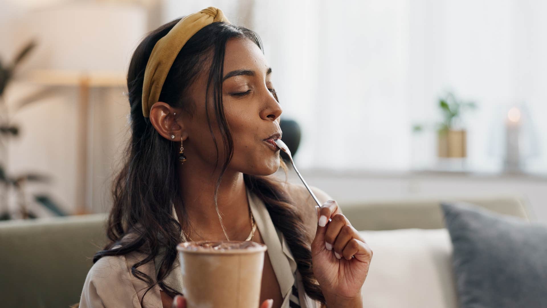 woman rewarding herself with food eating ice cream