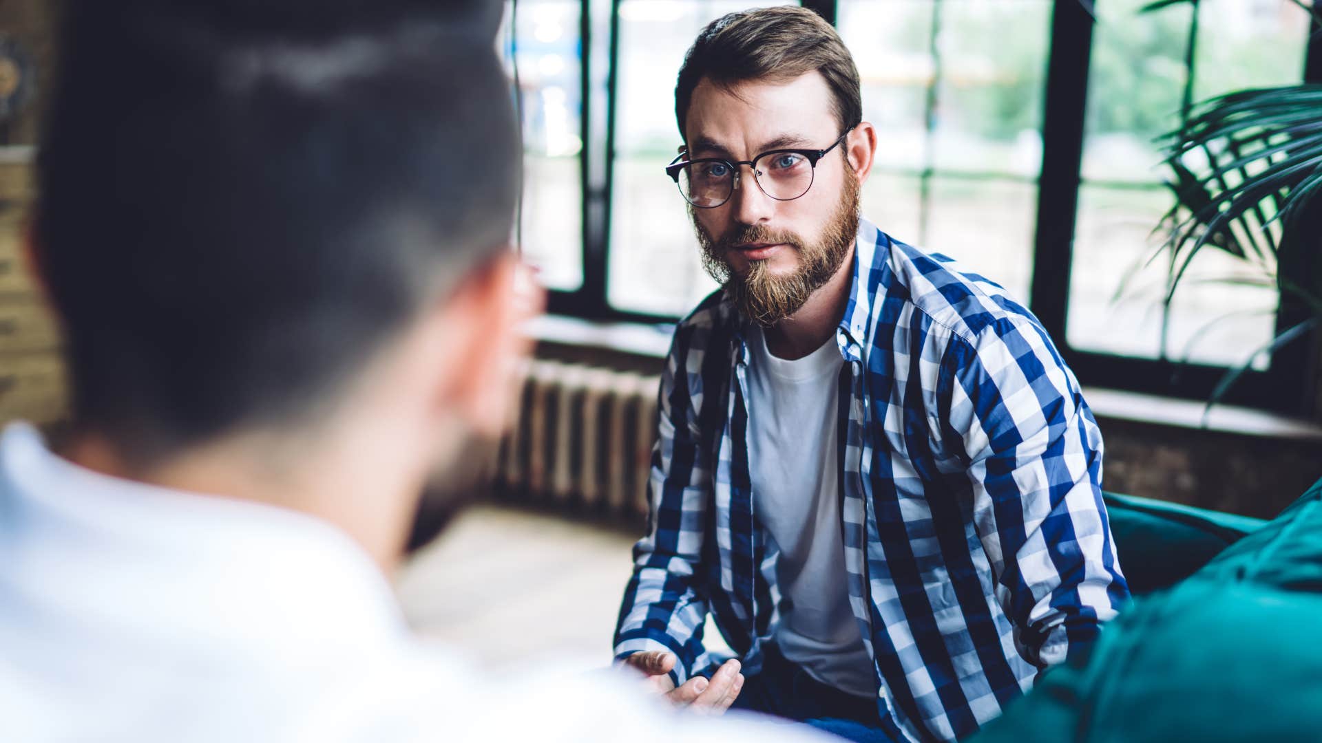 man receiving financial advice from someone who's never struggled