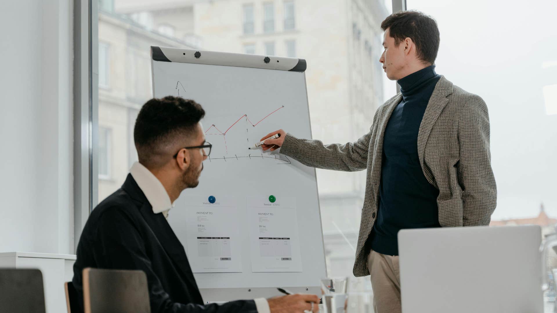 man giving presentation at work pointing out patterns