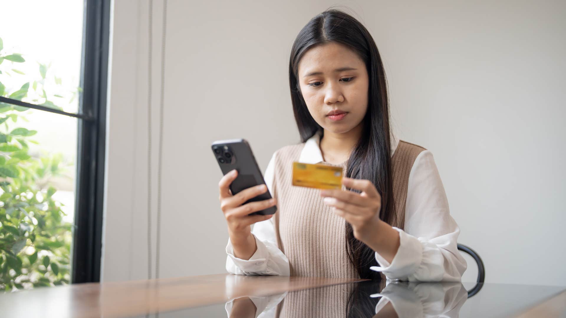 woman with her credit card waiting for a sale