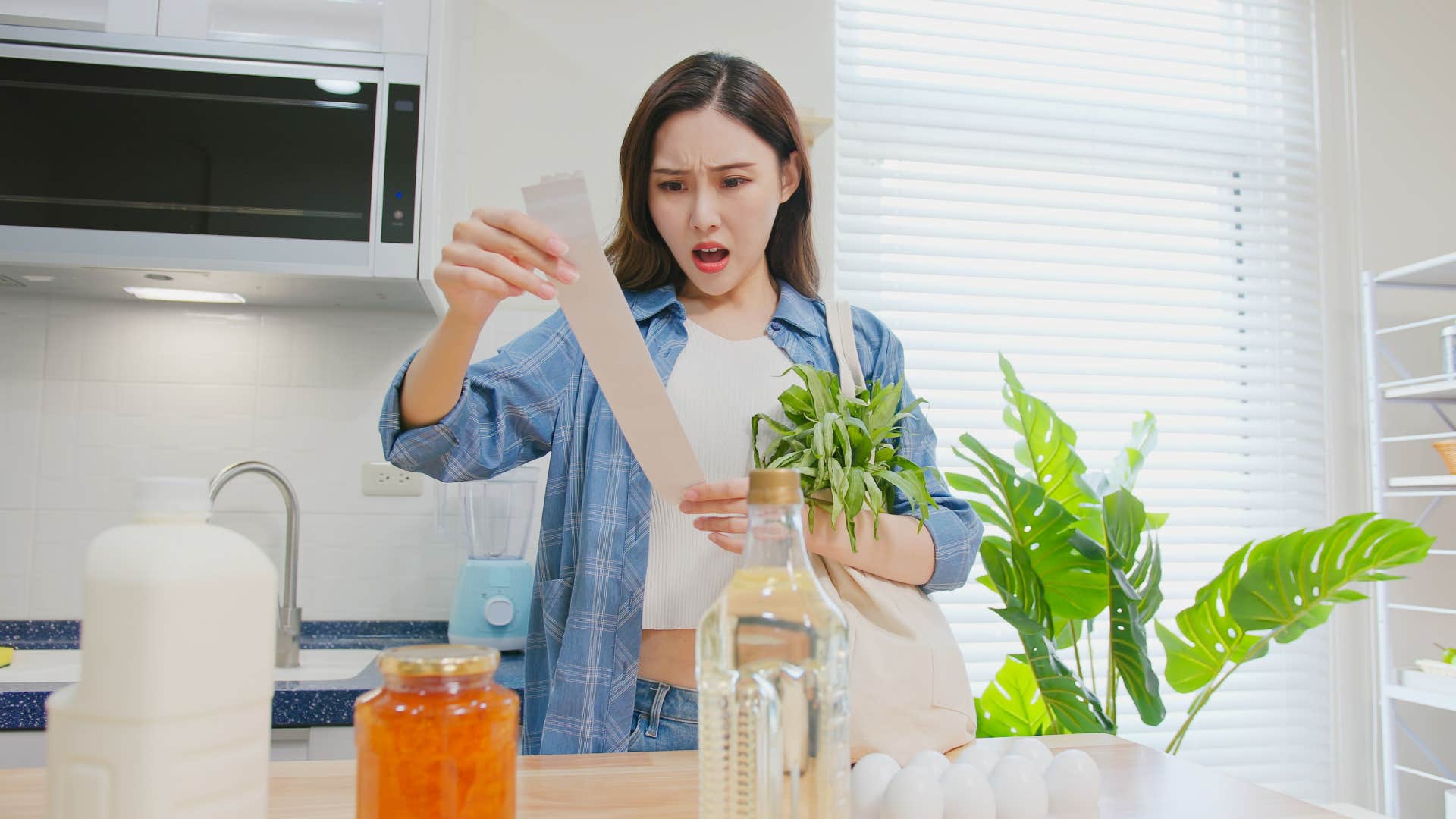 Shocked person with receipt always makes life harder