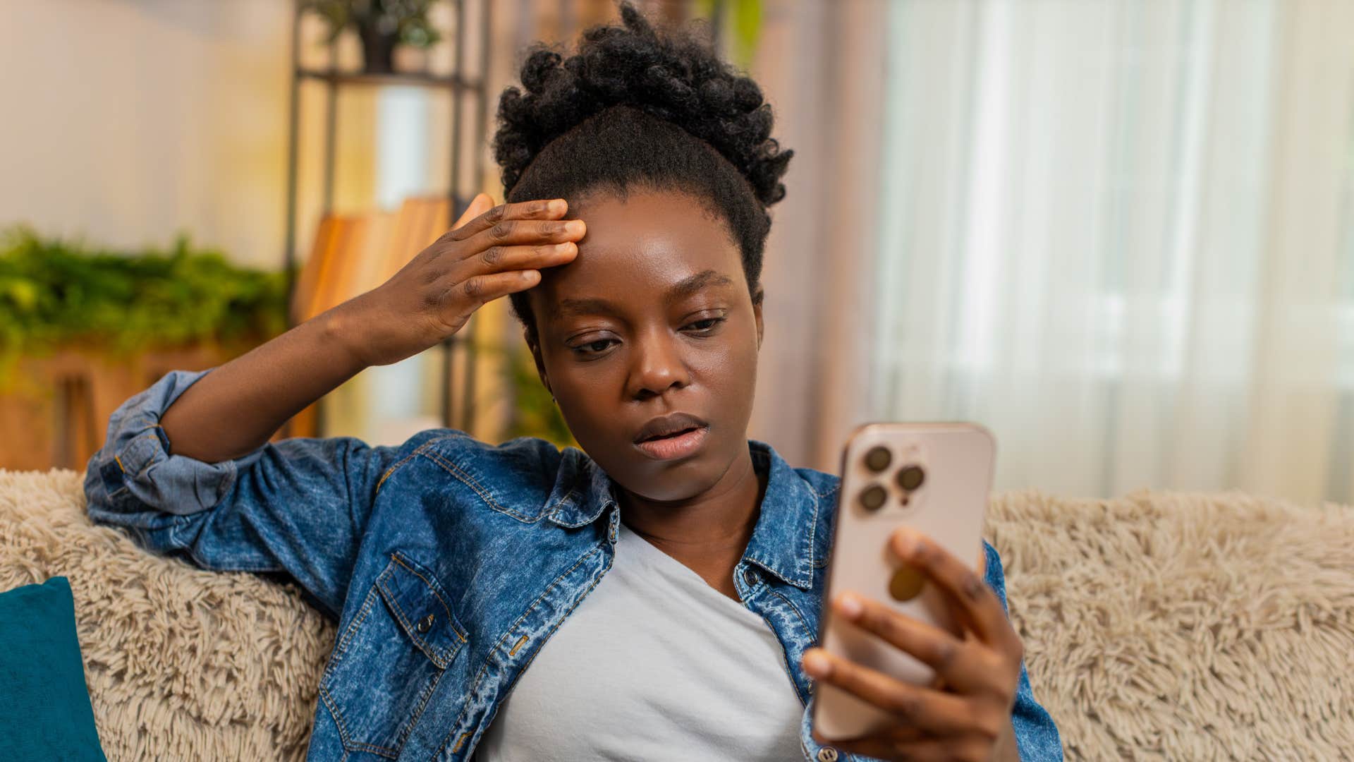 Upset person looks at phone and feels they should do something showing way to make life harder