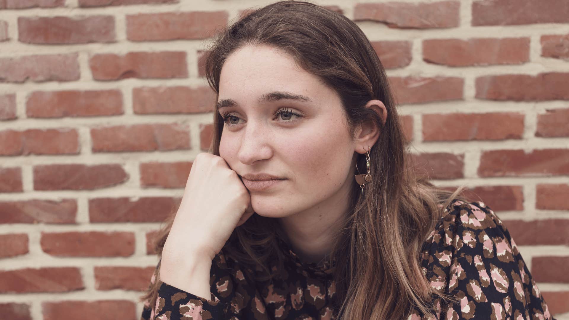 Woman with serious expression doesn't care what others think 