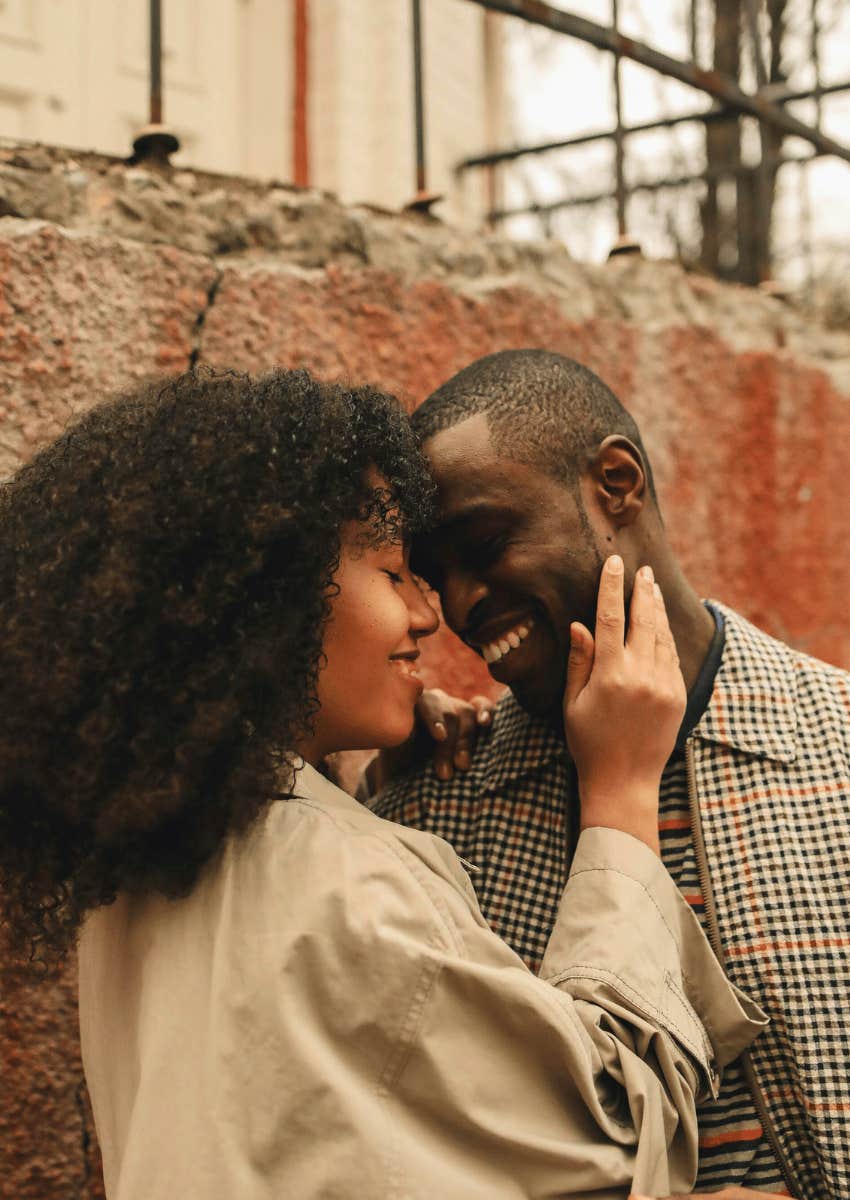 playful couple standing close to each other