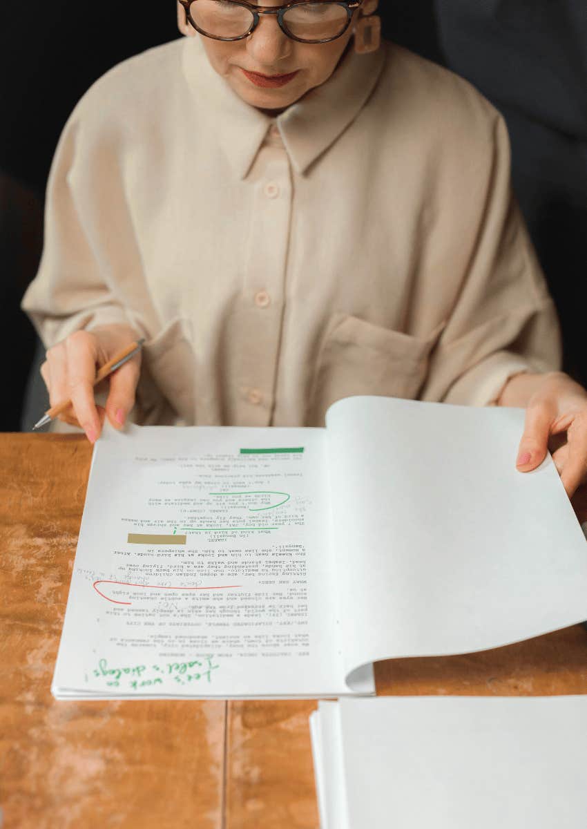 professional woman marking up a document