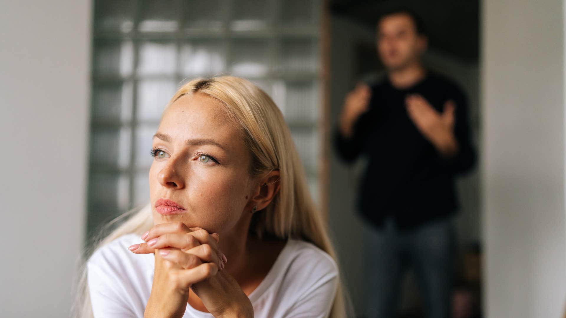 woman ignoring man as she stopped explaining her choices