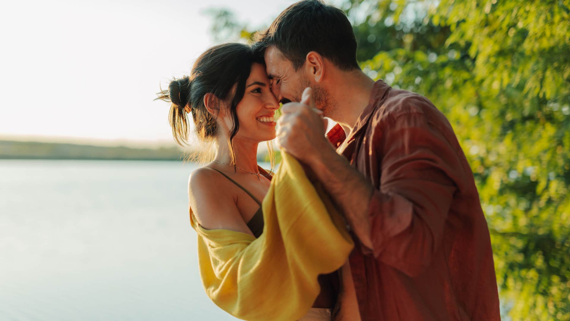 man showing woman he's not going anywhere by staying close to her physically