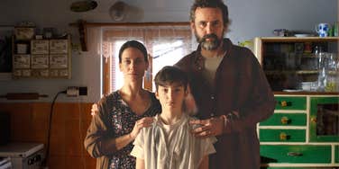 Middle class family stressed out, worried— just getting by. 