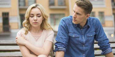 sad angry couple drifting apart