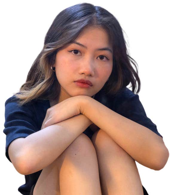 Sad woman looking down, symbolizing emotional pain and self-doubt before starting the Mastering You self-love and healing course