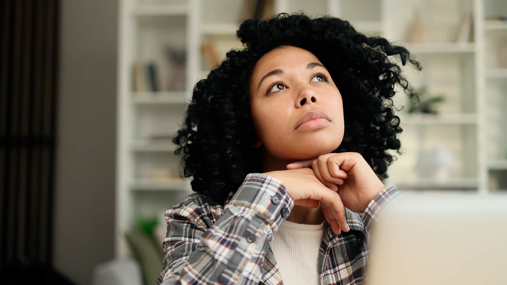 woman who has passed her soul's most painful test as she learned stillness is strength