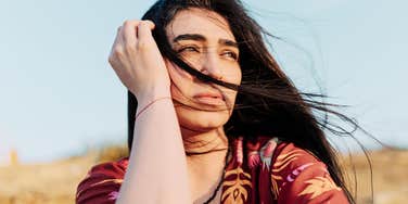 Serene person sitting quietly in reflection, symbolizing spiritual growth and the moment you realize you’ve passed your soul’s most painful test.