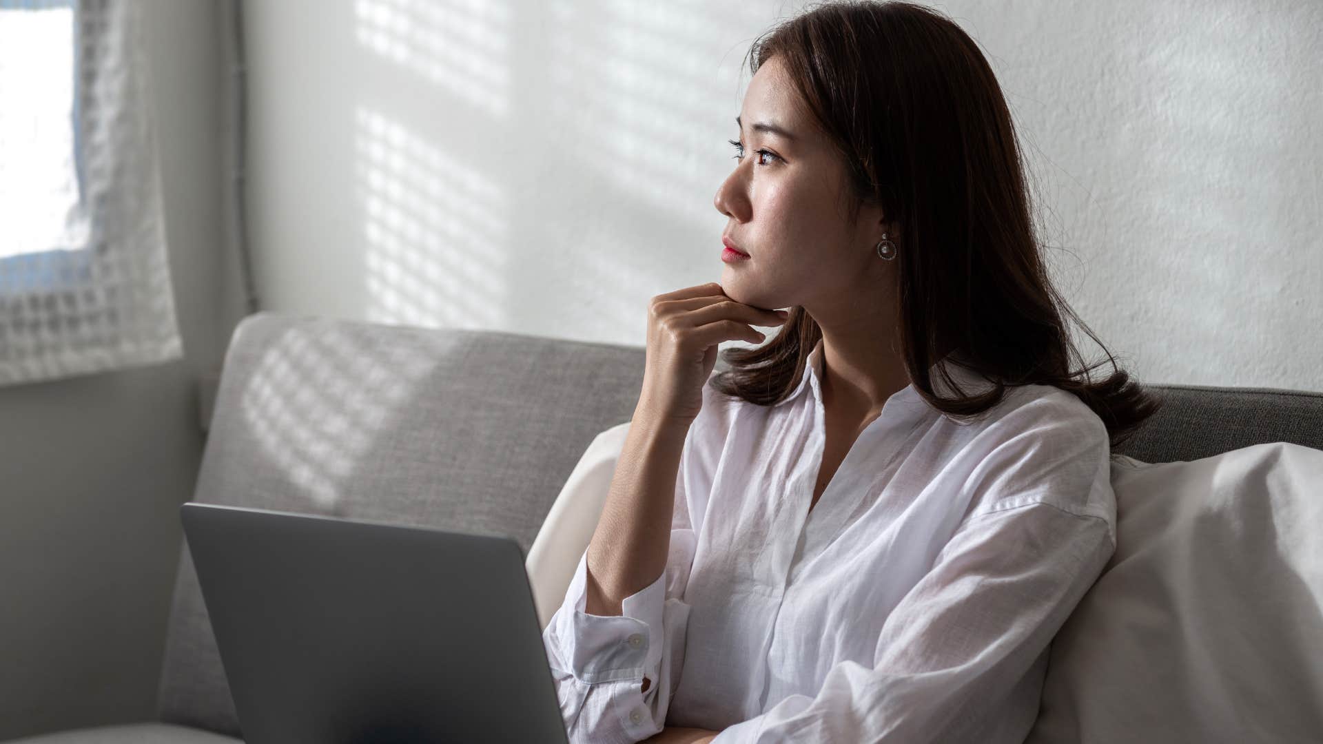 woman analyzing herself sitting at home