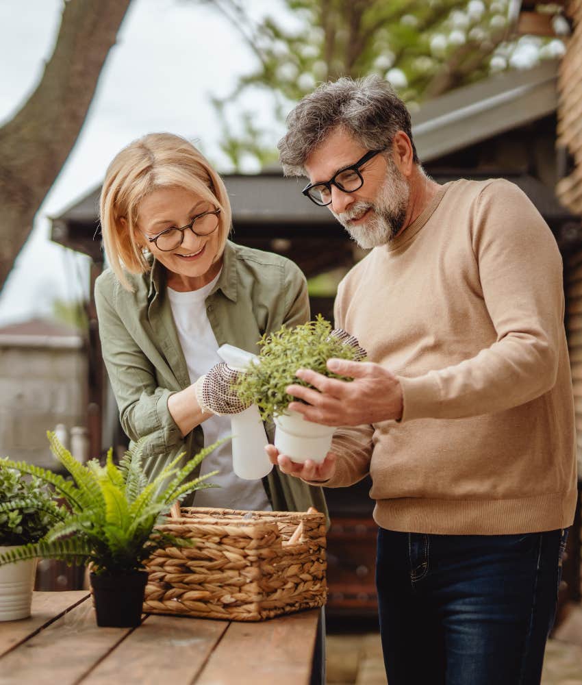 Romantic couple tend plants showing you never know when mad love strikes