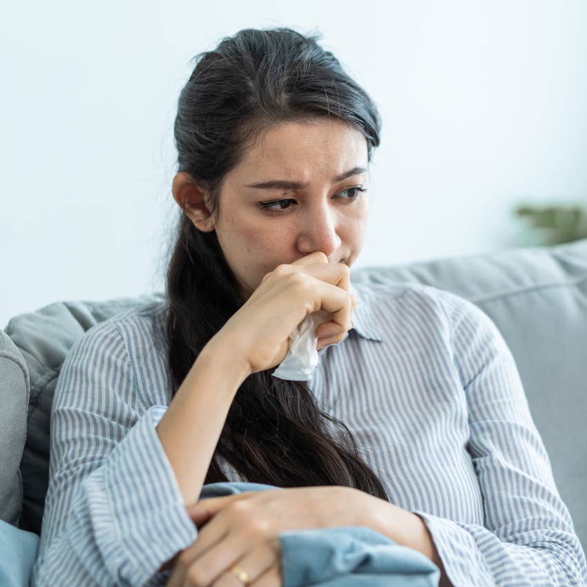 woman who has a feeling of heaviness as someone is sending her bad energy