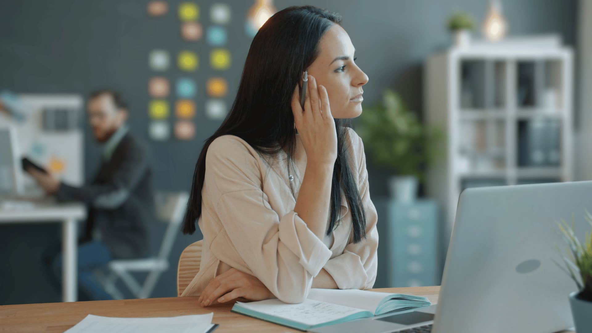 pensive woman in office thinking of possible opportunities