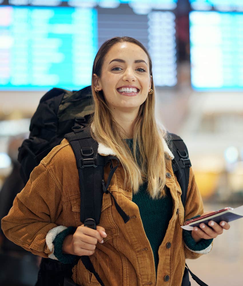 Happy woman faces fear of traveling alone