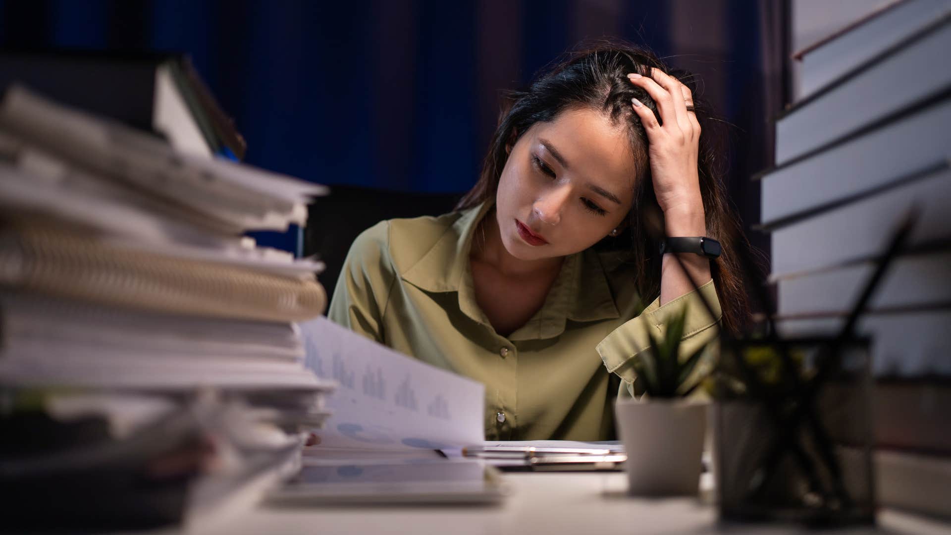 woman swamped with work after employees left her