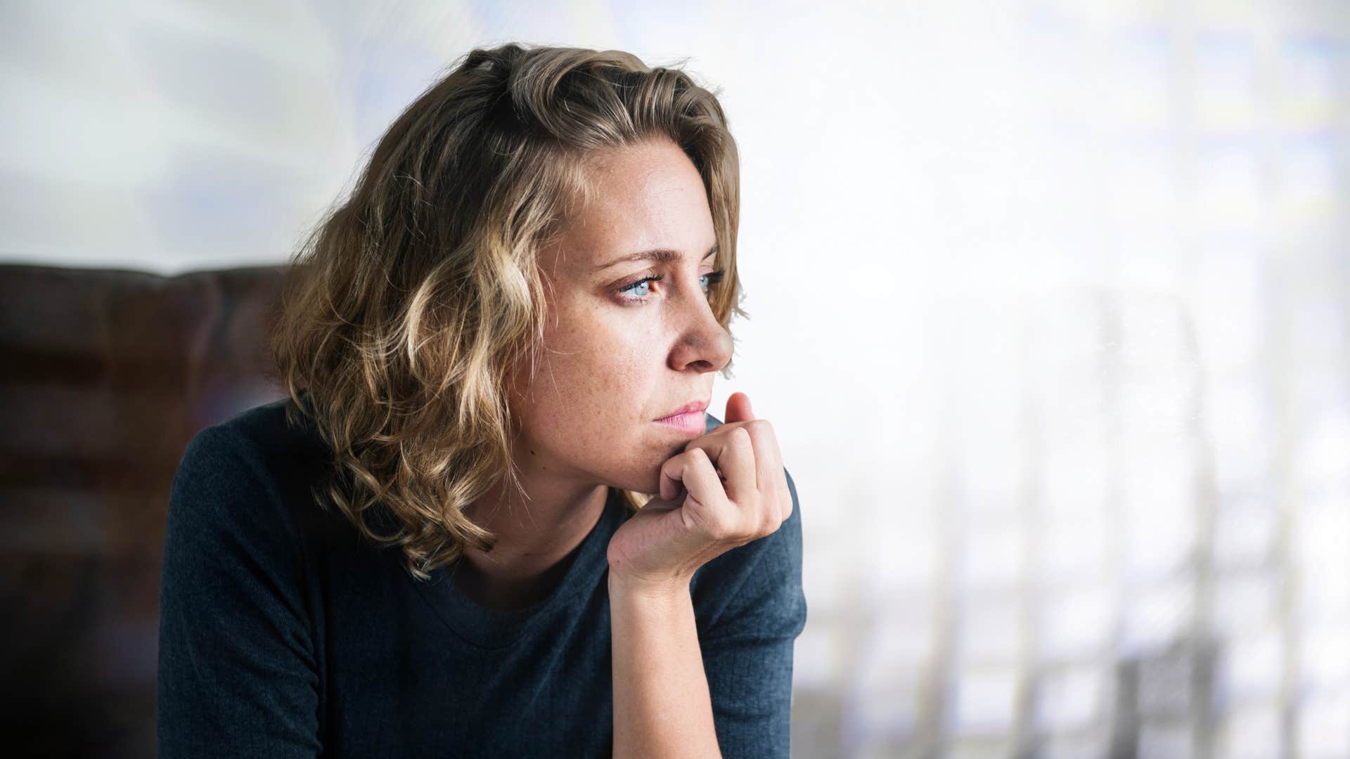sad pensive woman accepting it's okay to feel angry or frustrated