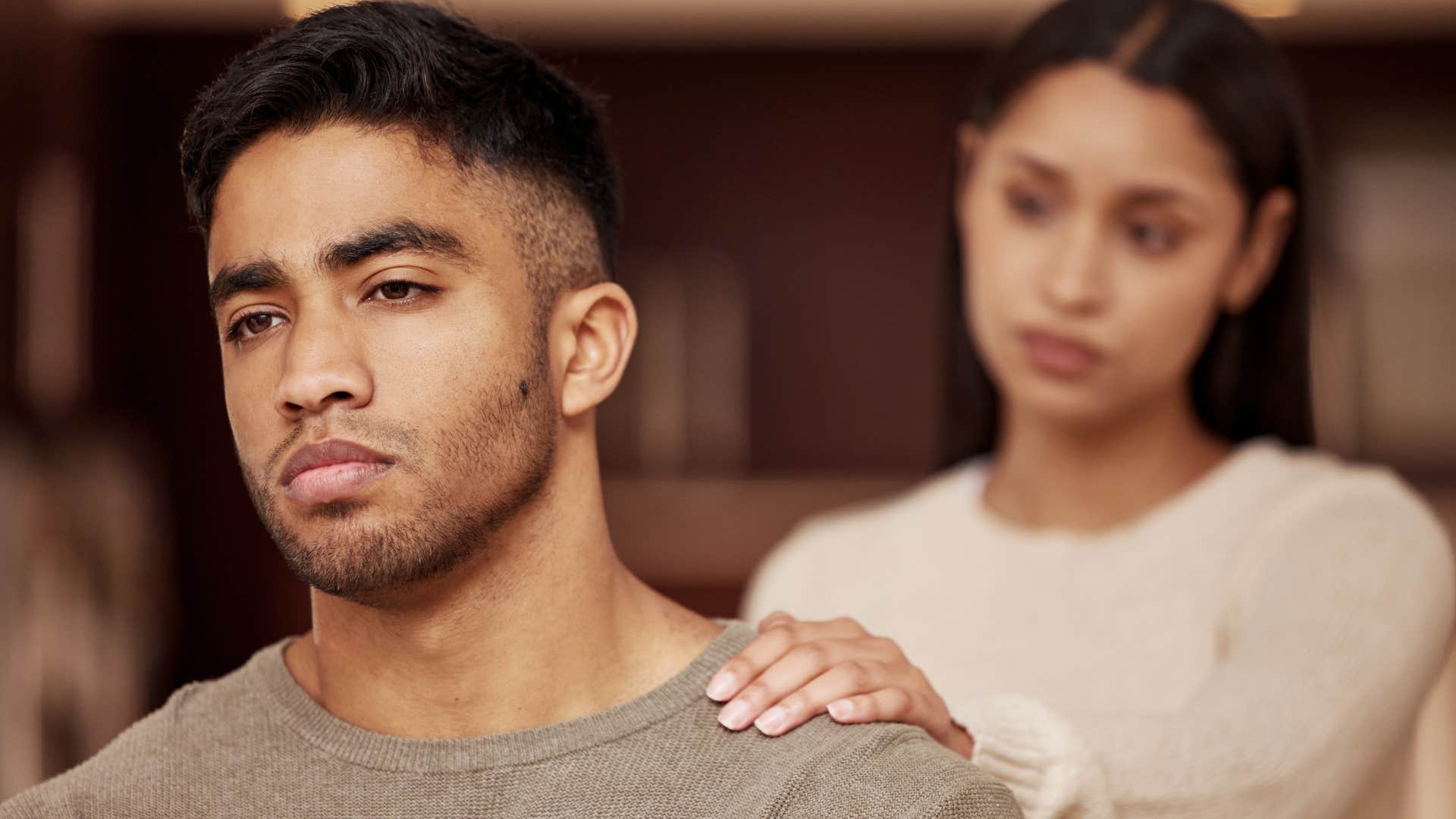 man rejecting woman trying to get his attention