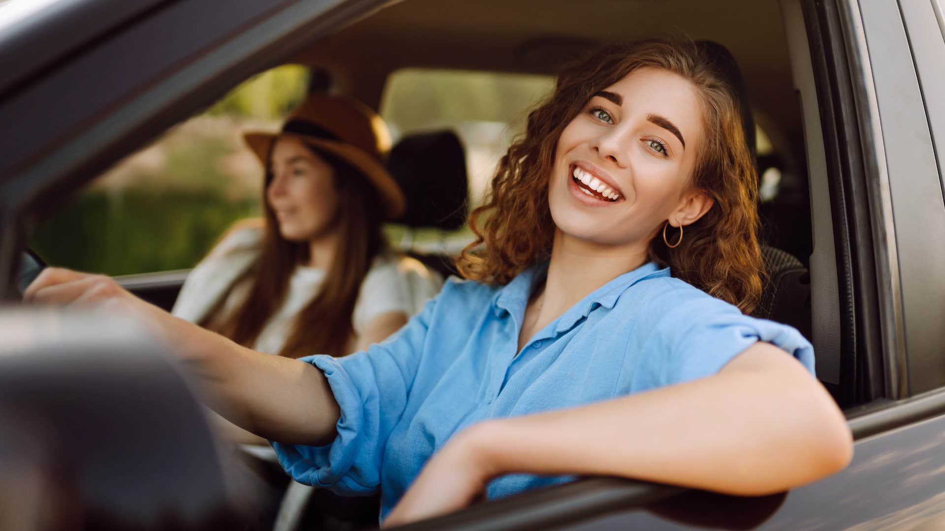 woman smiling driving after getting her license