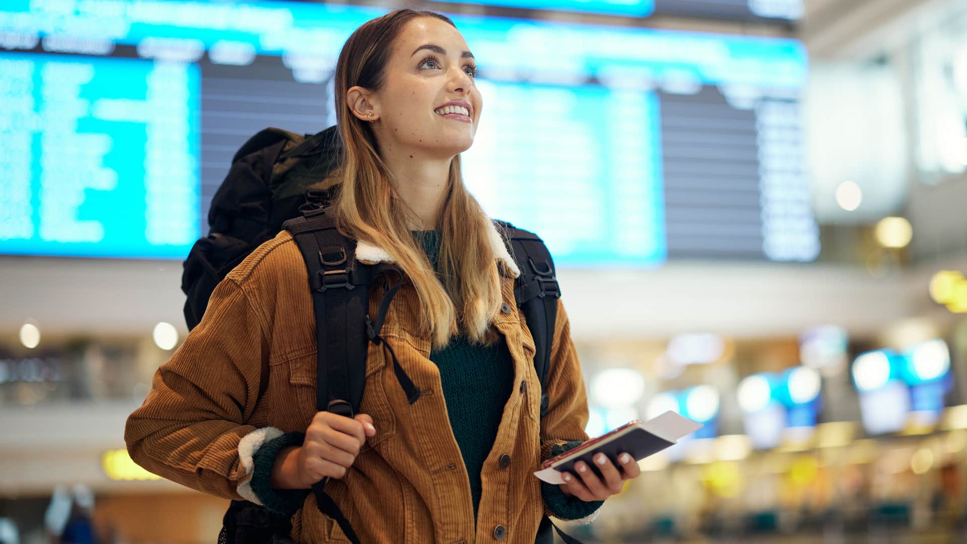 woman at the airport about to go on vacation